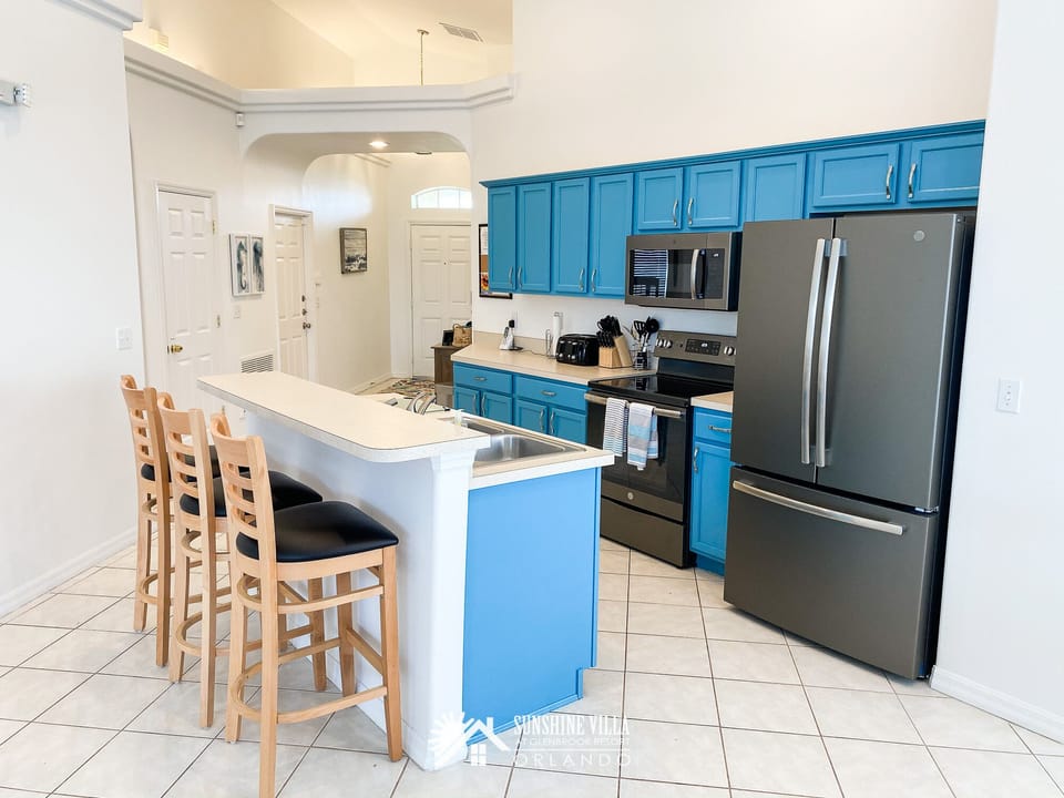 Bright kitchen stocked with appliances