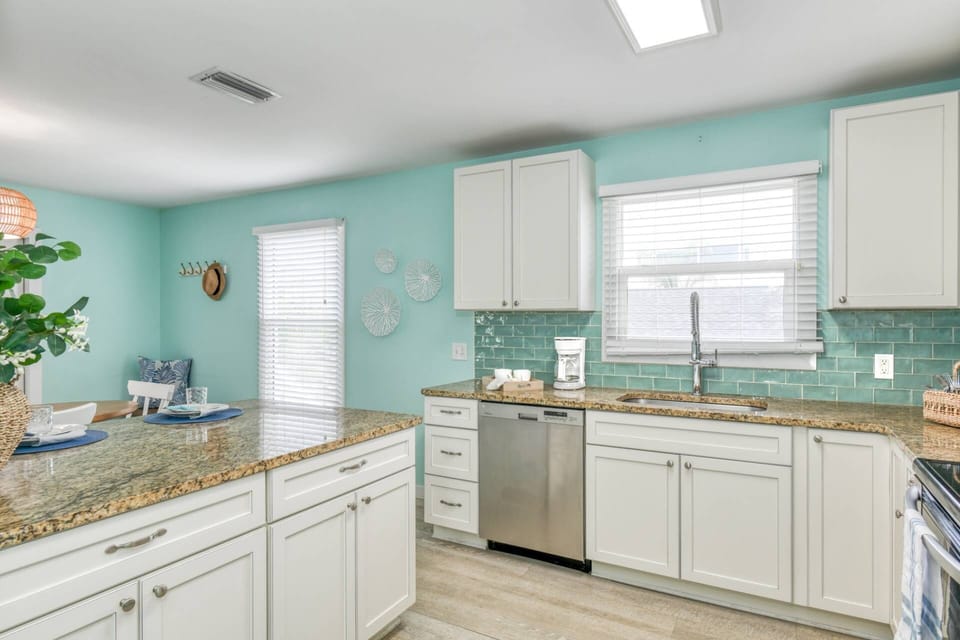 The beautifully finished and fully stocked kitchen has everything you need to prepare your favorite foods and drinks.