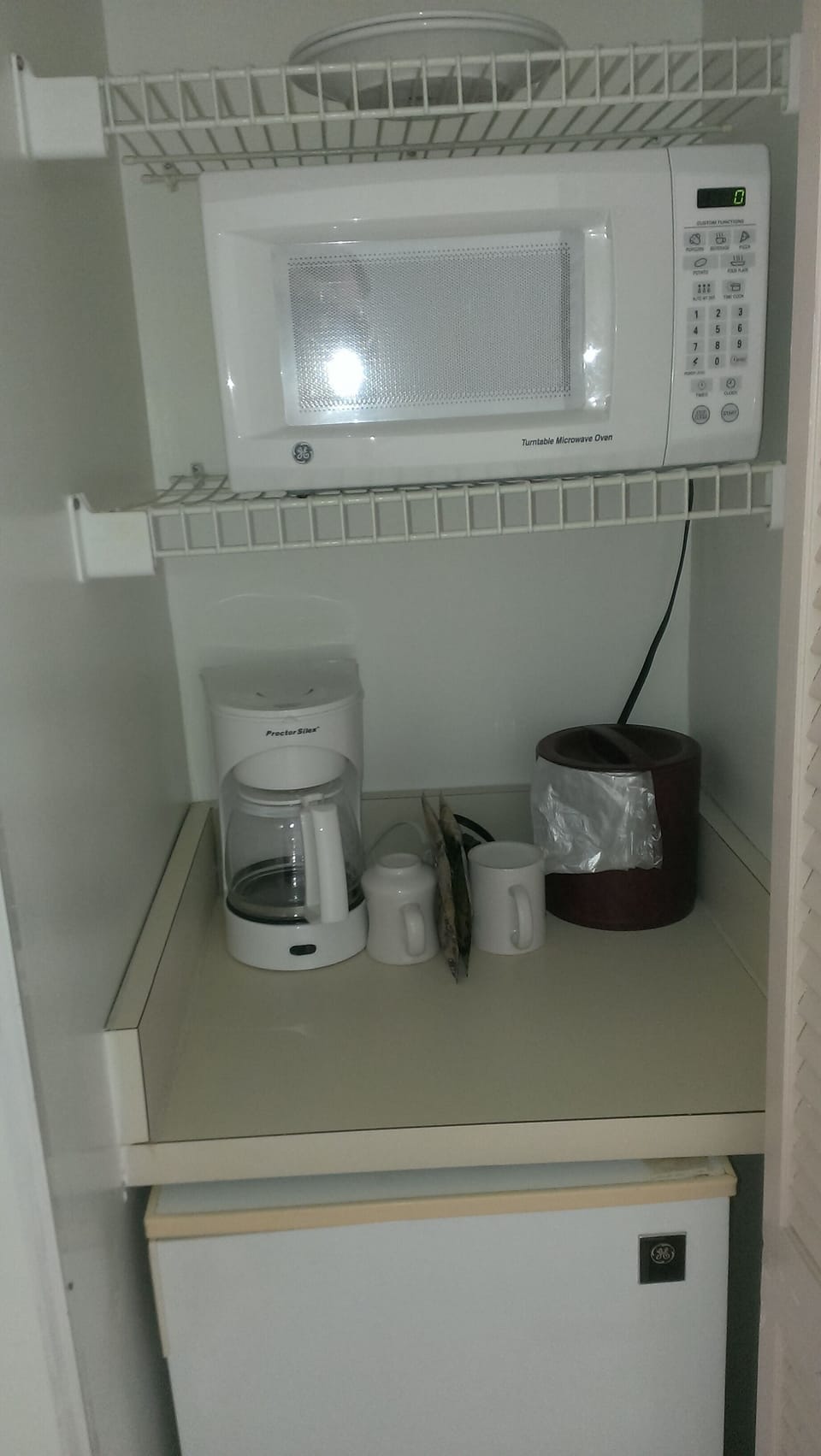 Mini Kitchen Microwave, coffee maker, and dorm refrigerator for your convenience