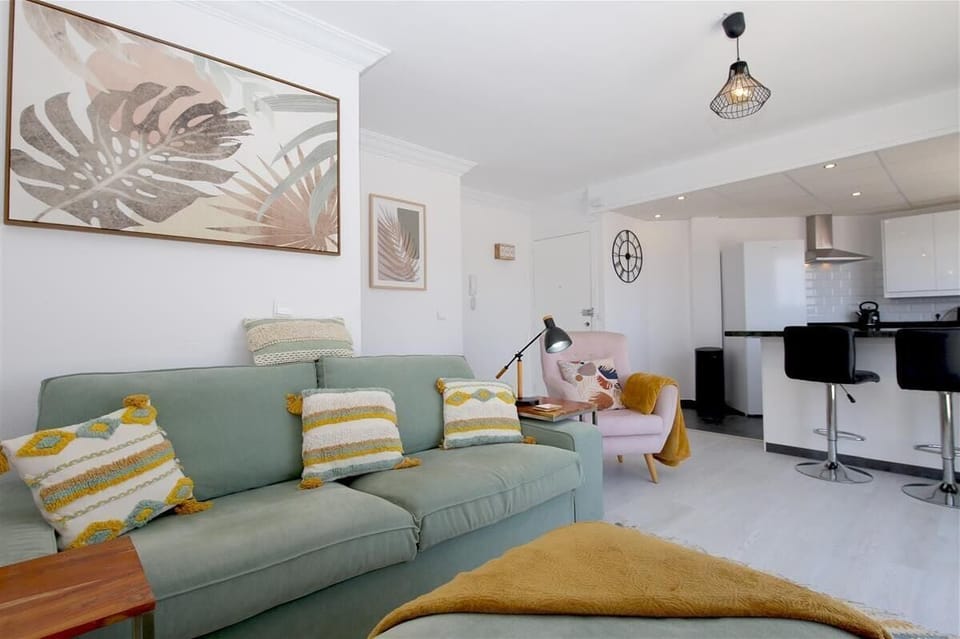 More pictures of the stylish lounge area with kitchen to the rear