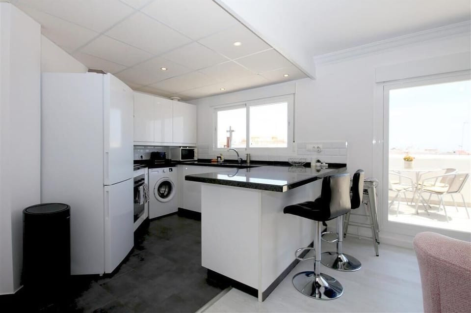 Another picture of the modern kitchen with breakfast bar