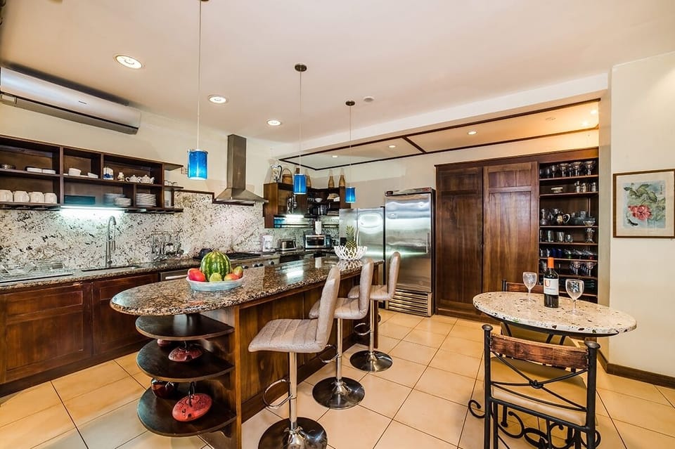 This large kitchen is fully equipped for preparing meals and hosting guests.