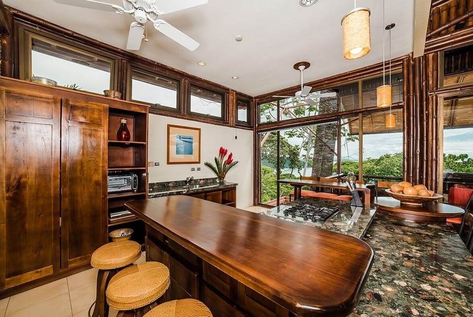 This kitchen feature a bar area perfect for eating breakfast.