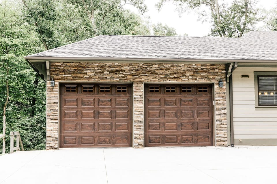 Front of the house, off street parking to the left garage door 