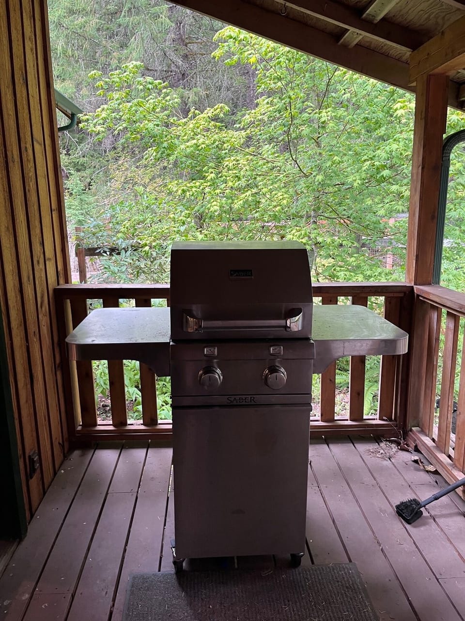 BBQ grill on covered porch off kitchen