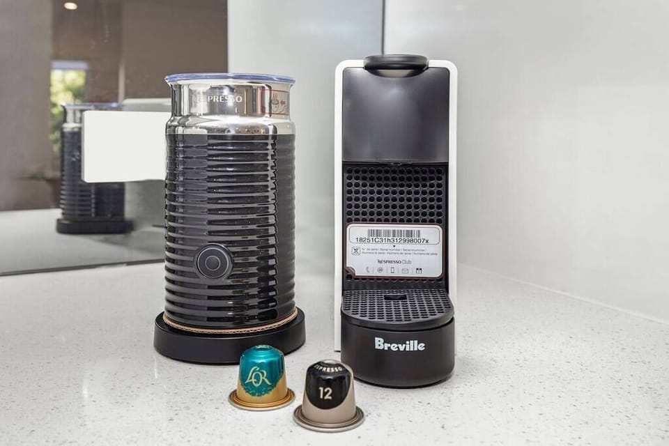 Nespresso pods and milk frother add an easy café-style coffee setup.