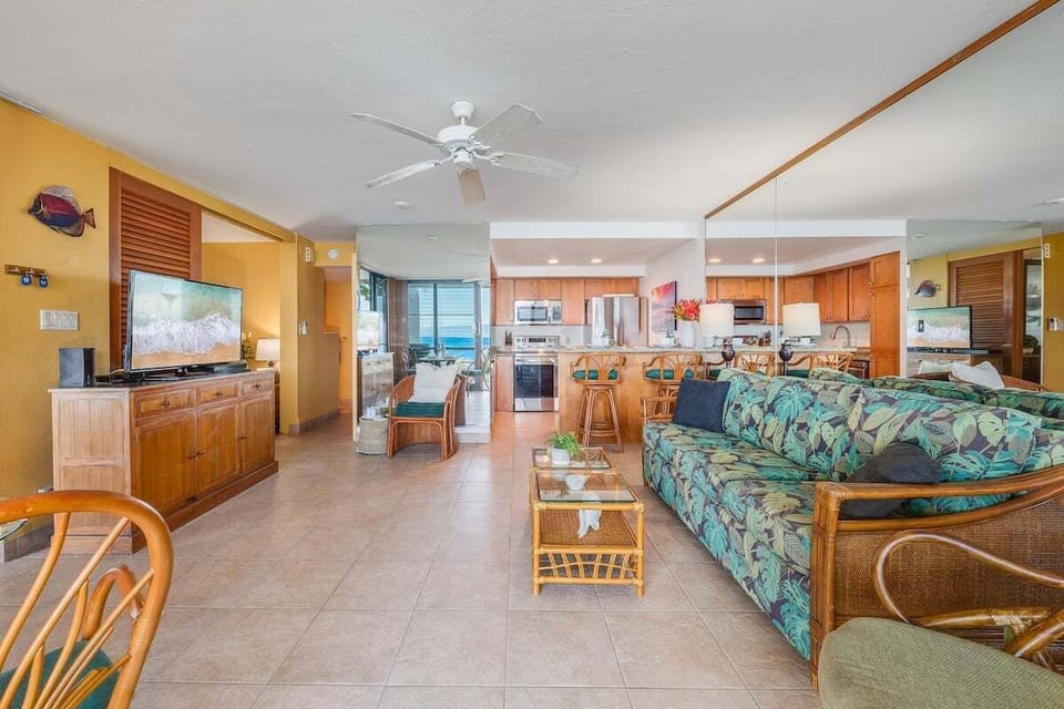 The living room features a cozy sleeper sofa, perfect for additional guests or families needing extra sleeping space.