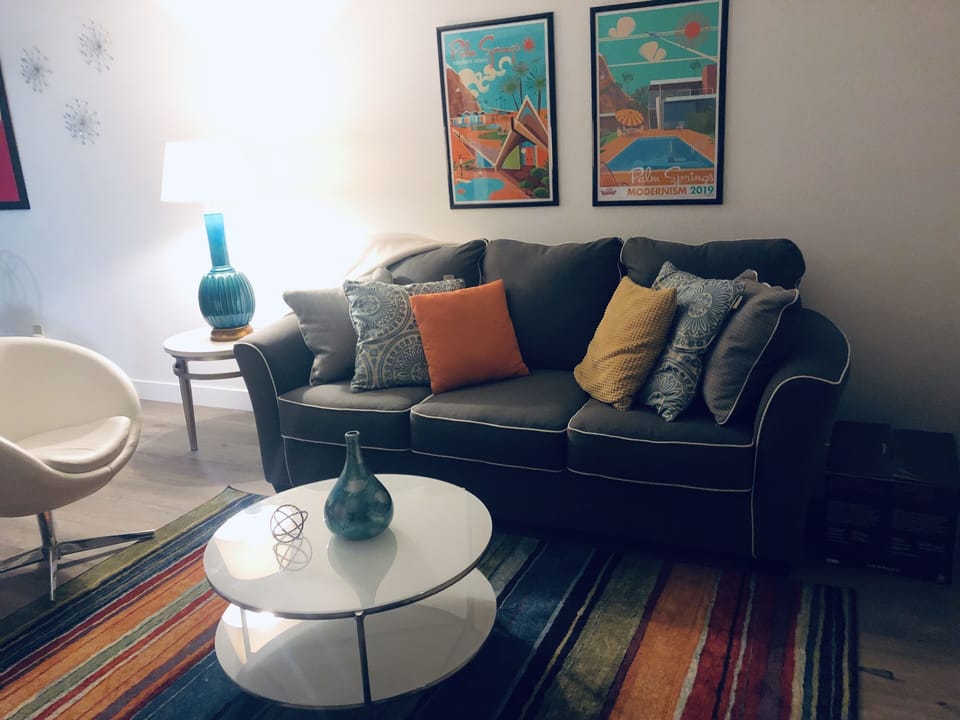 Living room with decor wall art from local artist.