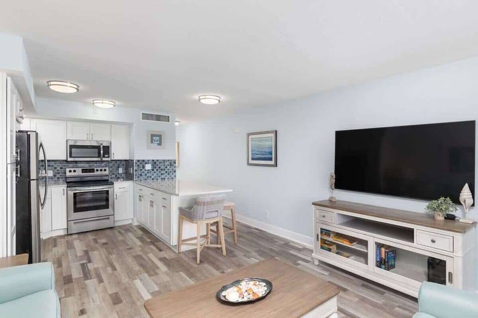Fully equipped kitchen with brand new appliances and large island with breakfast bar style seating