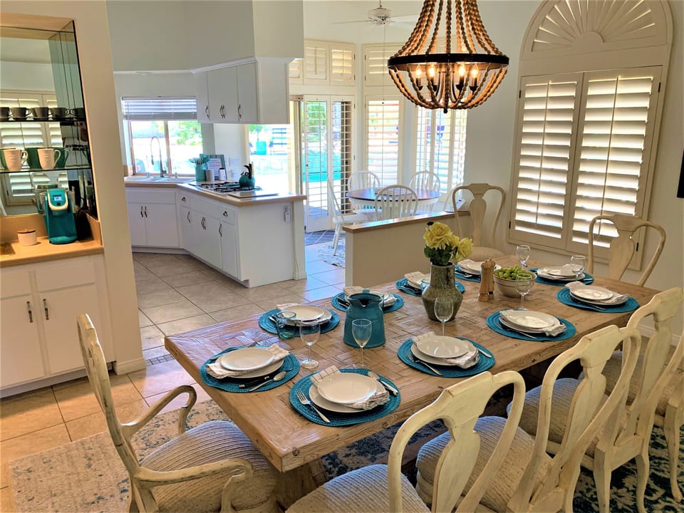 Dining room adjacent to nook and kitchen with a beautiful pool view!