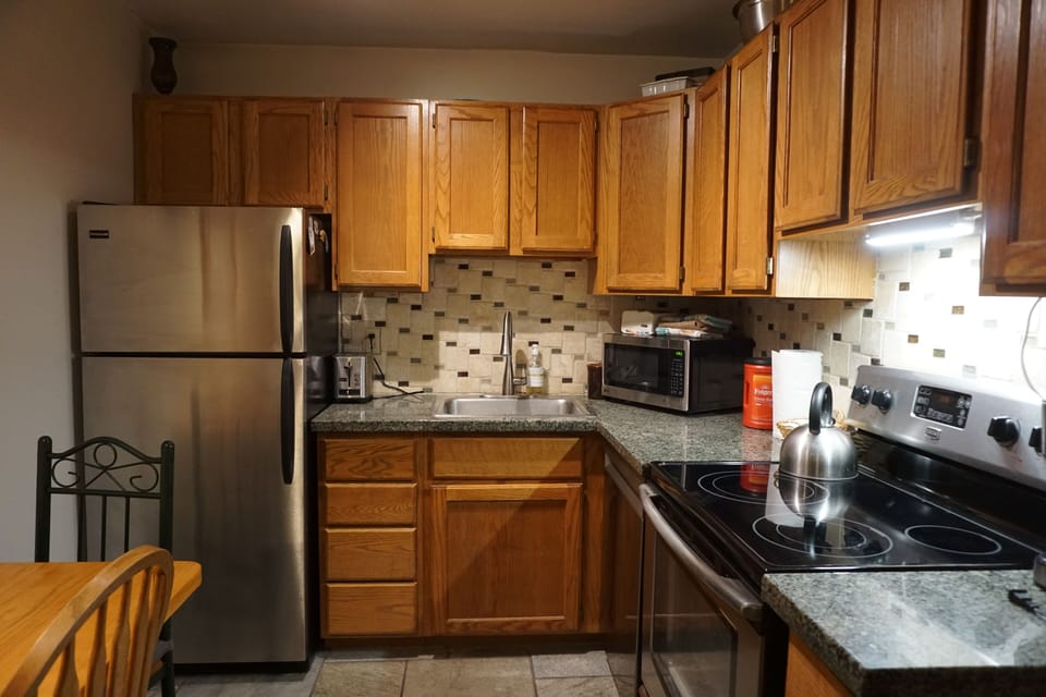 Fully equipped kitchen, new appliances,  countertops, plenty of cookware.