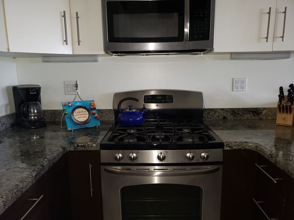Gas stove and oven.  Large microwave oven 