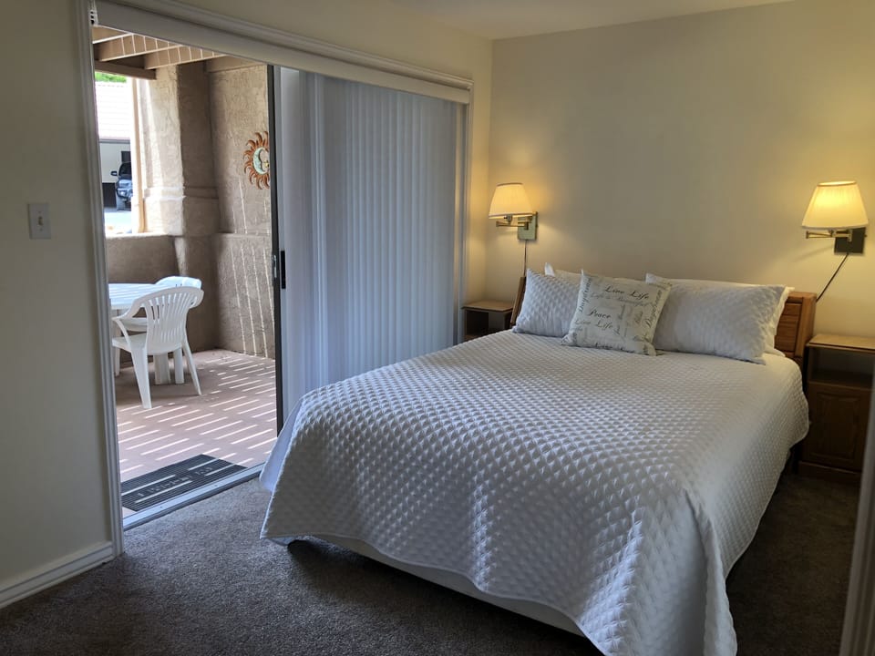 2nd bedroom with view to private patio