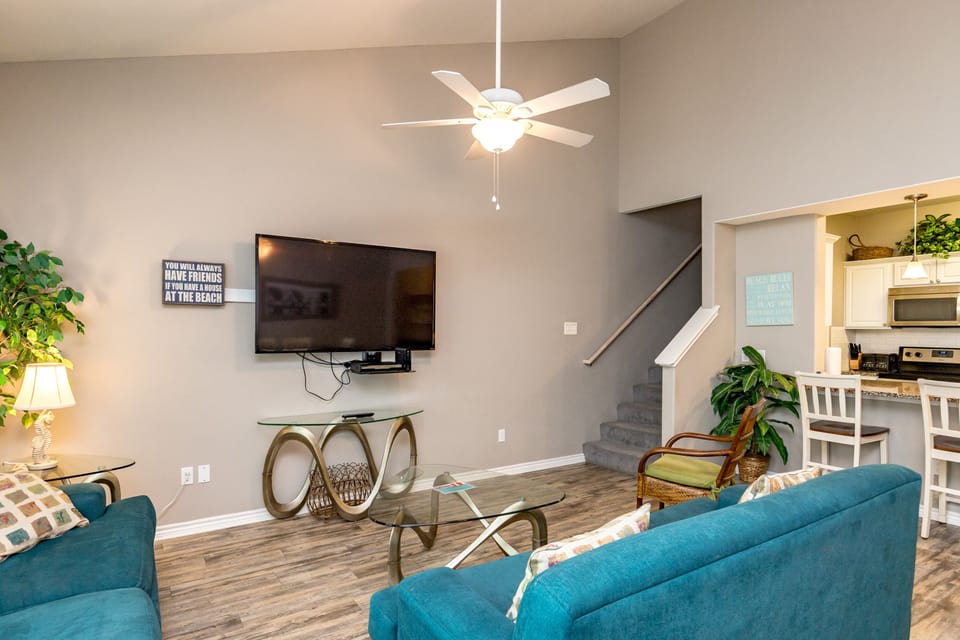 Modern entertainment haven boasting a state-of-the-art flat-screen TV, streaming services, and comfortable lounging options for movie nights