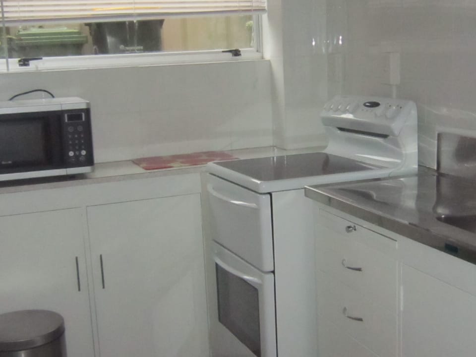 Full Kitchen with conventional oven and microwave - toaster and kettle.