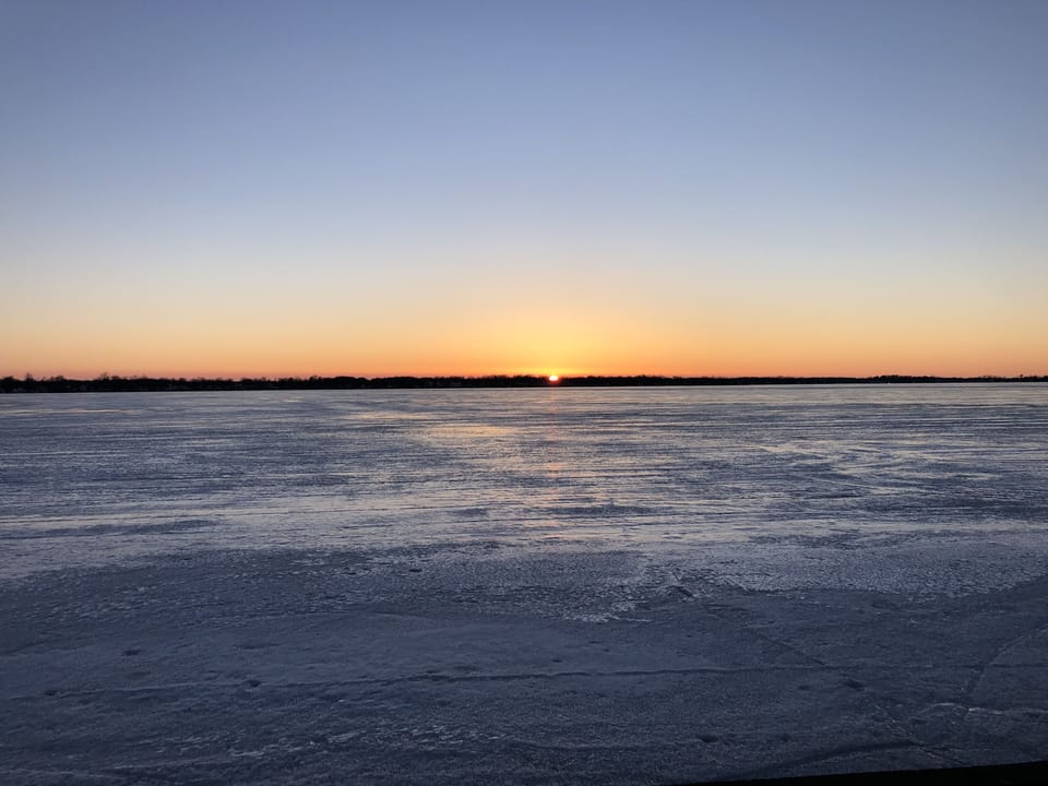 Lake sunset. Perfect for ice fishing and ice sailing in the winter.