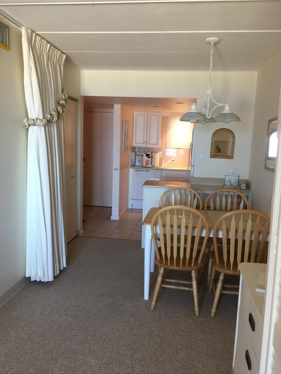 eating area
extra small closet on the left beyond the curtain.  