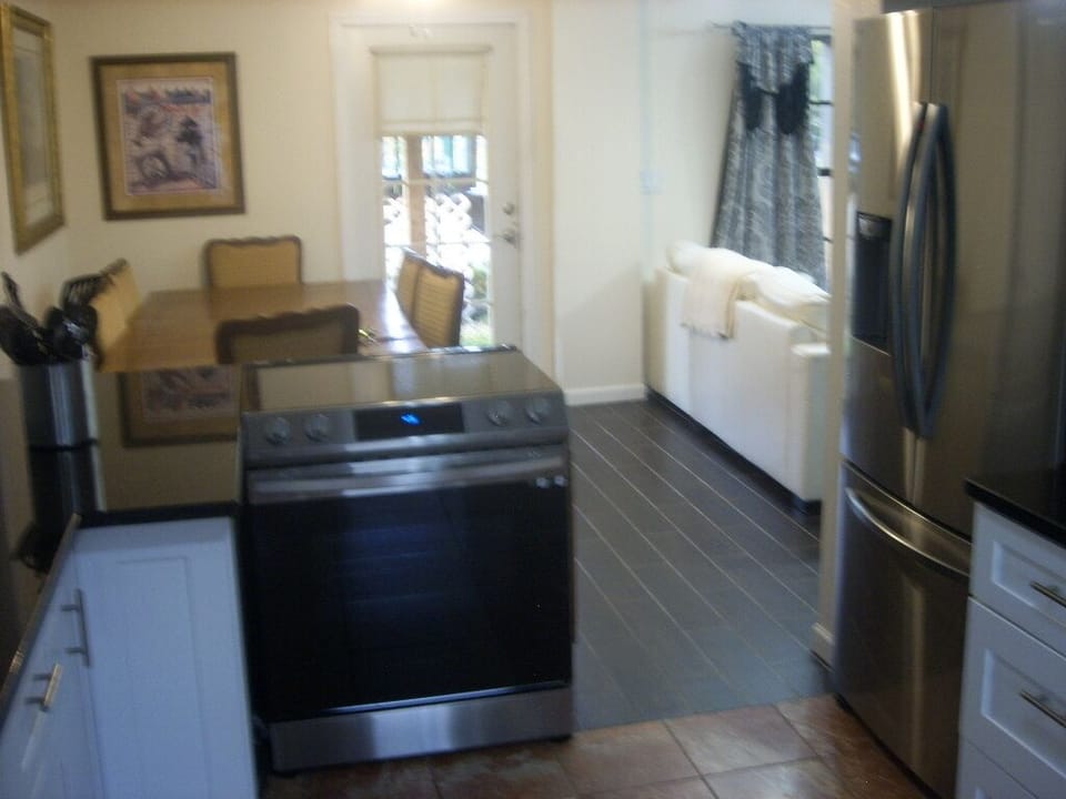 Dining area  from view of kitchen and island stove
