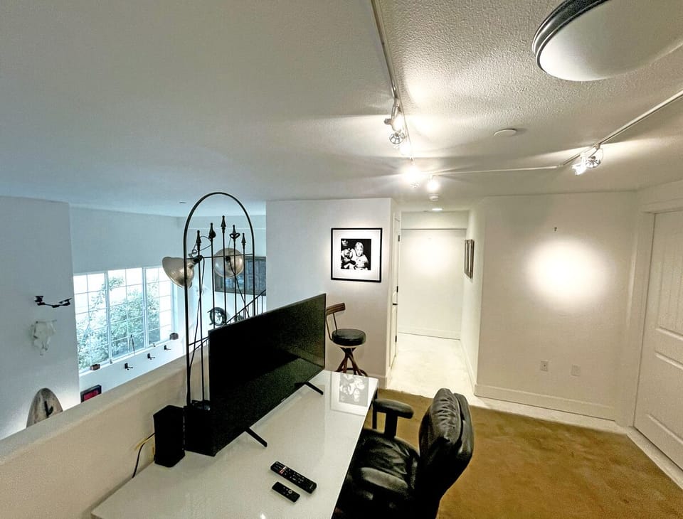 Upper loft/bedroom.  Queen sized bed and single bed can be provided. 