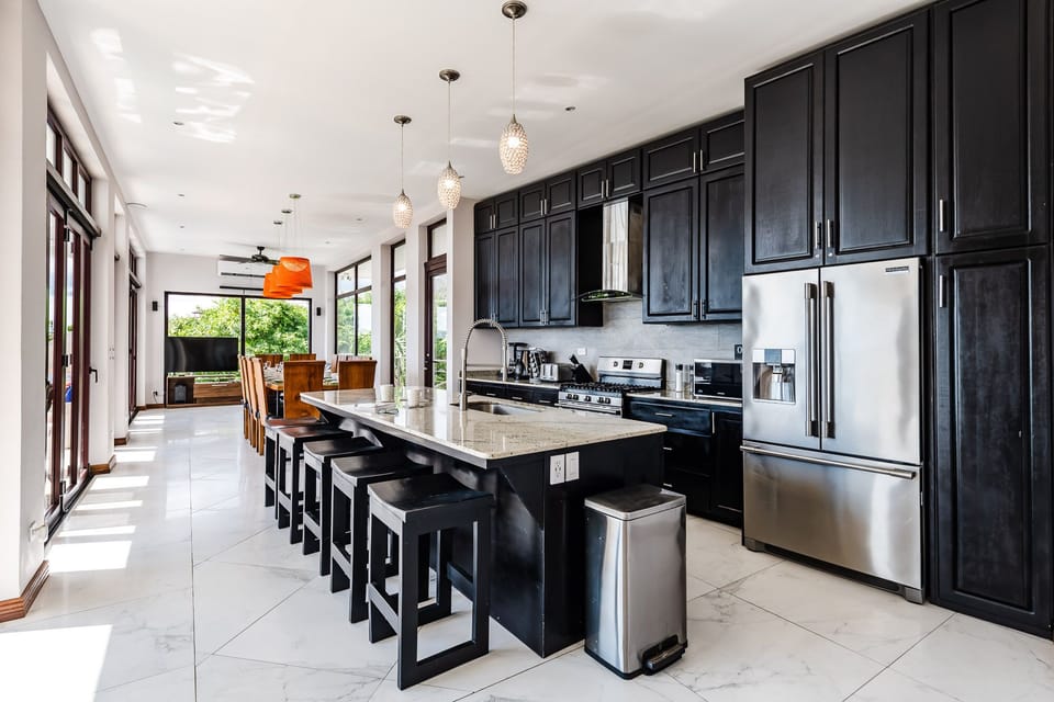 Fully stocked kitchen with seating for 5 at the island