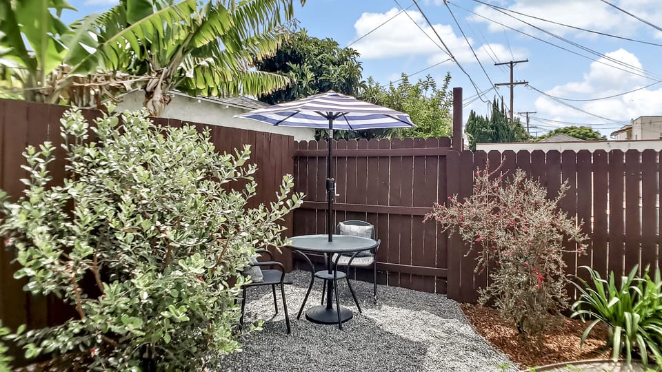 Enjoy a cup of coffee or tea at this bistro table.