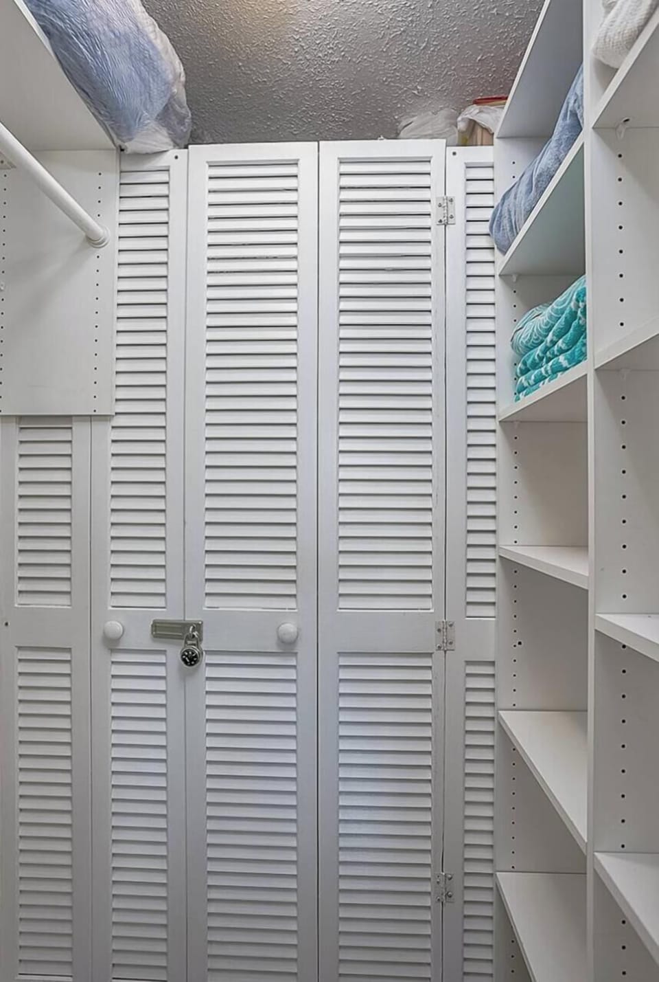 Twin bedroom has a walk-in closet with a pocket sliding door