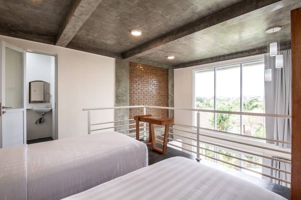 Single beds in each loft space can zip together to make a King bed