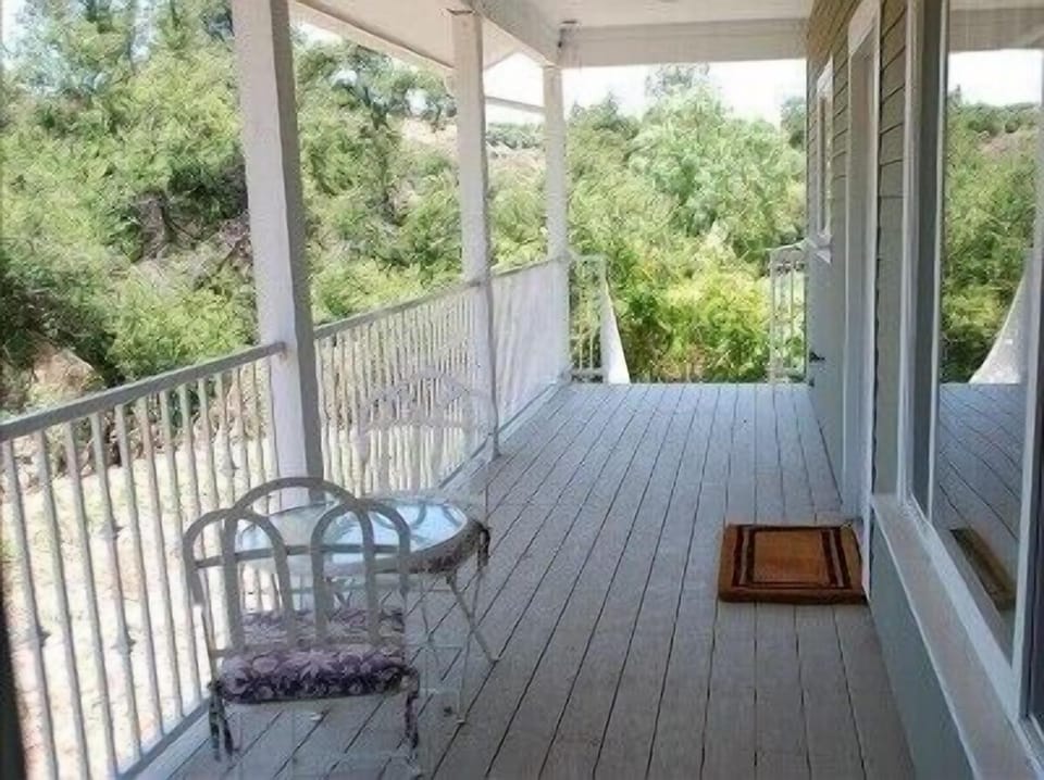 Wood Deck off En-suite Bedroom @ rear of house. Door off Kit also accesses deck
