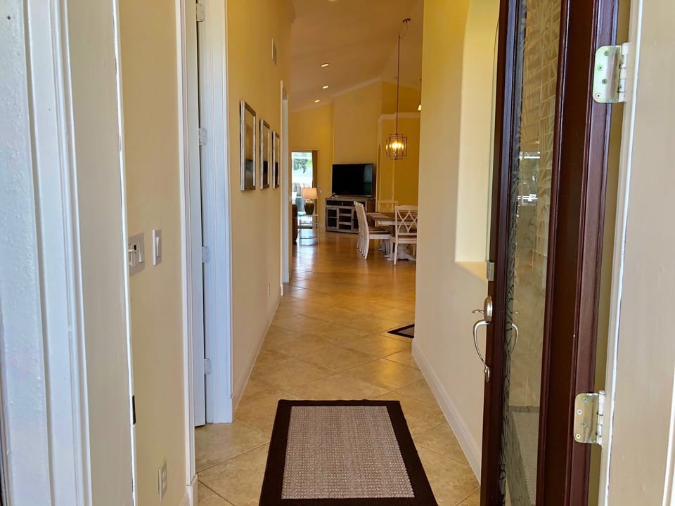 Spacious entrance foyer with two twin bedrooms on left.
