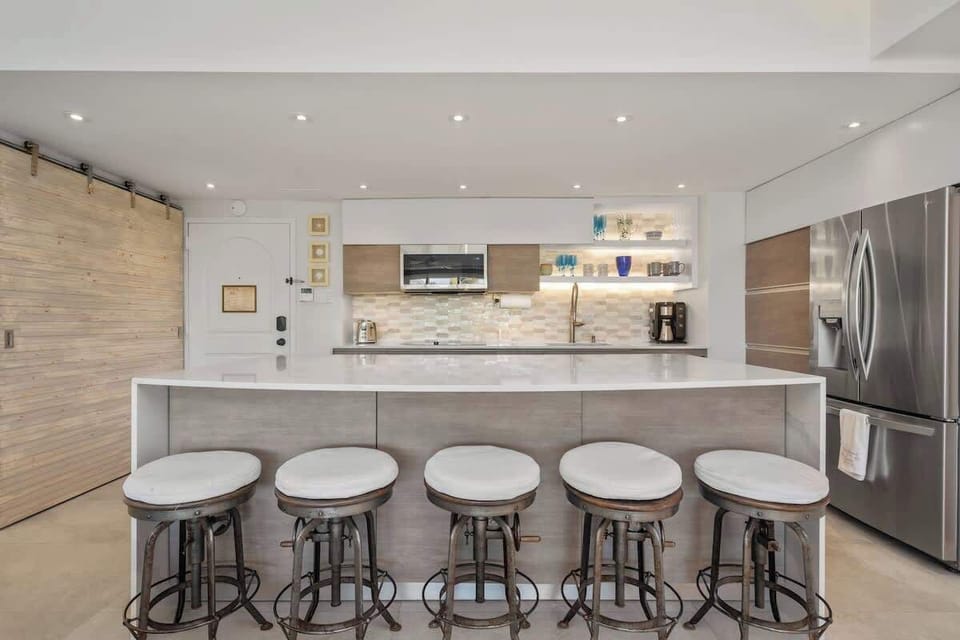 Fully stocked kitchen with flatware and cutlery.