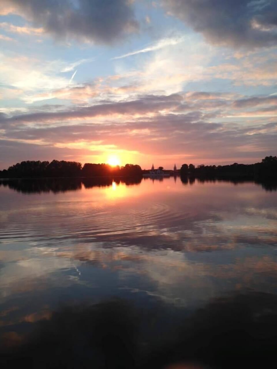 Enjoy a walk :  the lake just across the street ...