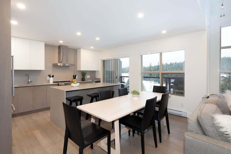 - Open-concept kitchen and dining area with natural light and mountain views  
- Perfect for shared breakfasts and cozy dinners after a day outdoors  
- Designed for comfort and connection during every mealtime  