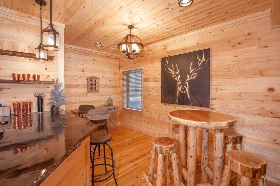 Bar with Live Edge Slab Countertop and Custom Log Hewn Round Table