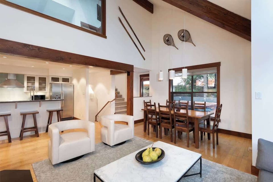 - Bright living space connecting seamlessly to the modern kitchen  
- Natural light enhances wooden accents and vaulted ceilings  
- Designed for gathering, relaxing, and enjoying your mountain escape