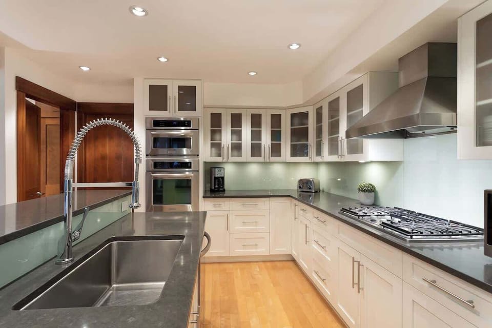 - Modern kitchen design with stone countertops and glass cabinetry  
- Top-of-the-line appliances and spacious prep area  
- Ideal for cooking comfort during your alpine stay  
