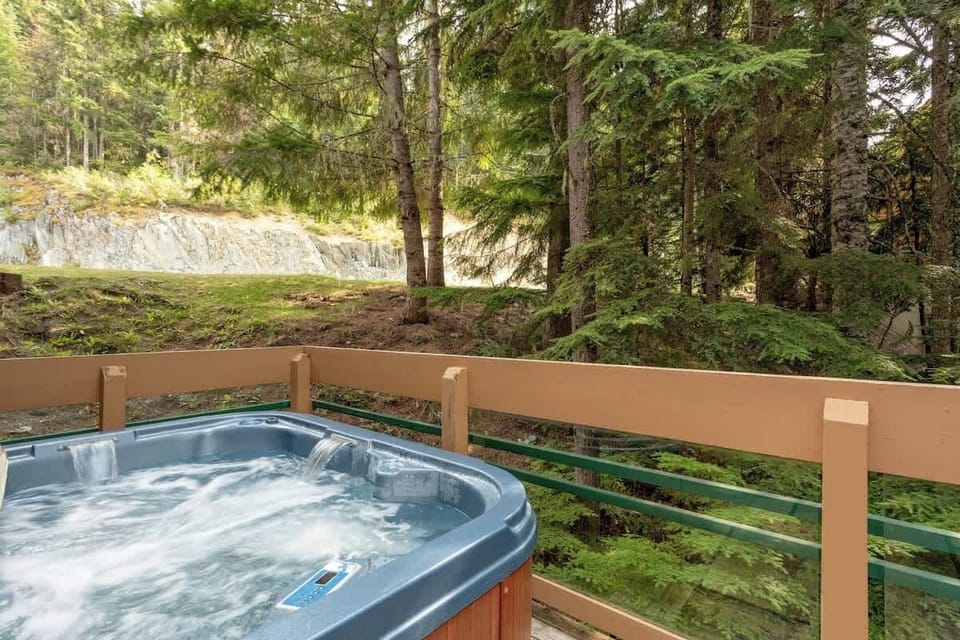 - Outdoor hot tub surrounded by whispering pines and fresh mountain air  
- Relaxing soak after a day of skiing or hiking nearby  
- Scenic deck overlooking nature’s tranquil beauty  
