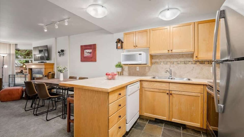 - Modern kitchen and dining area for family gatherings  
- Spacious Whistler condo with full amenities included  
- Ideal ski resort stay with cozy home-style comfort  