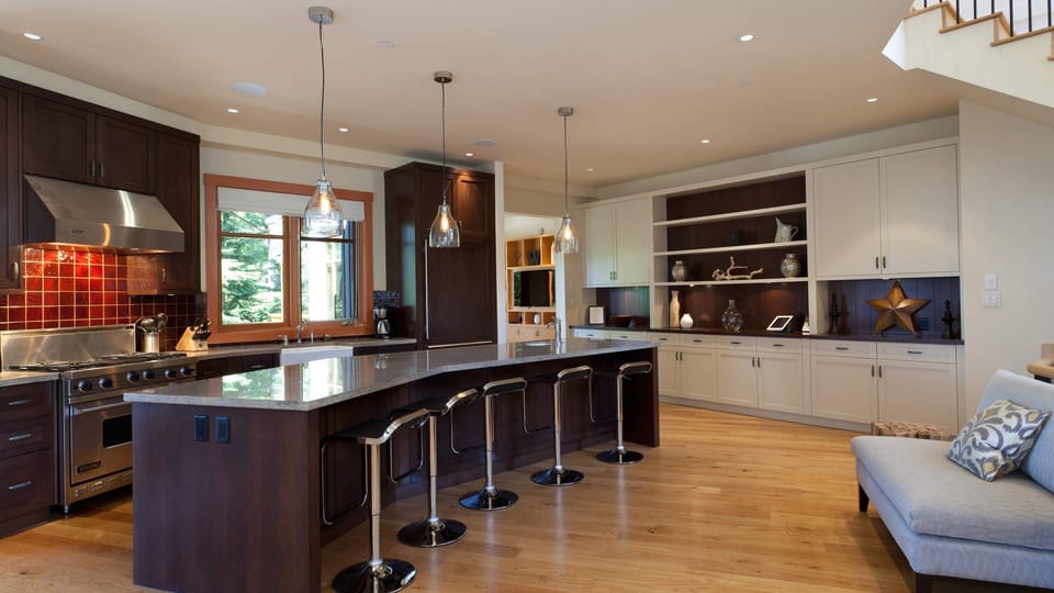 - Chef’s kitchen with sleek countertops and bar seating for gatherings  
- Fully equipped for cooking and entertaining in alpine comfort  
- Modern design meets mountain warmth for shared meals