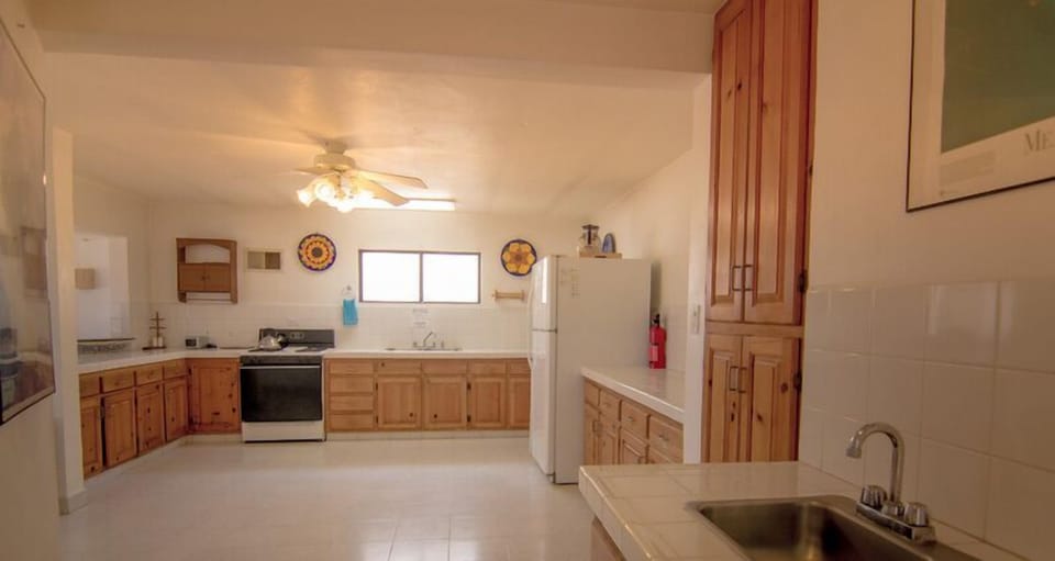 The ample kitchen is well equipped for entertaining big parties