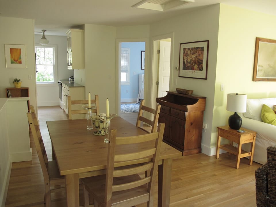 From dining area toward kitchen, bedroom, and bath