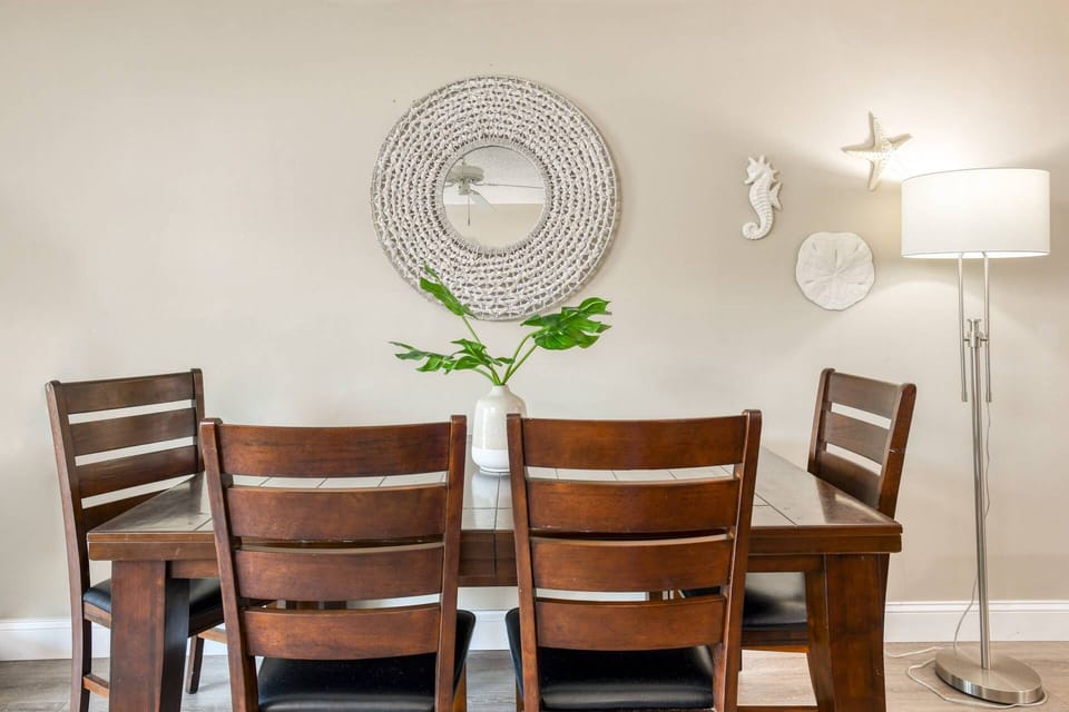 The dining table has plenty of space to share a meal together.
