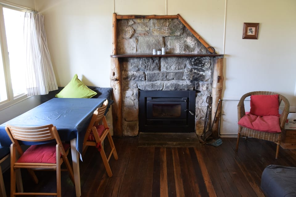 Cabin 1 dining area and wood burning stove