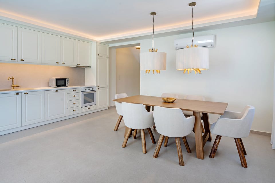 Fully equipped kitchen with wine cooler.