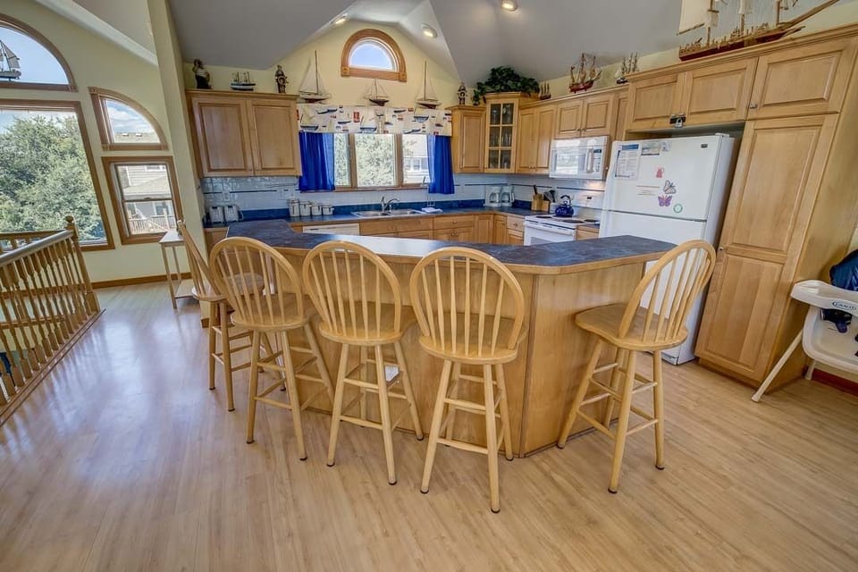Top-Level Kitchen with Bar (seats 5) ** The high chair seen in photos is no longer at the property. If baby equipment is needed local rental options can be provided. **
