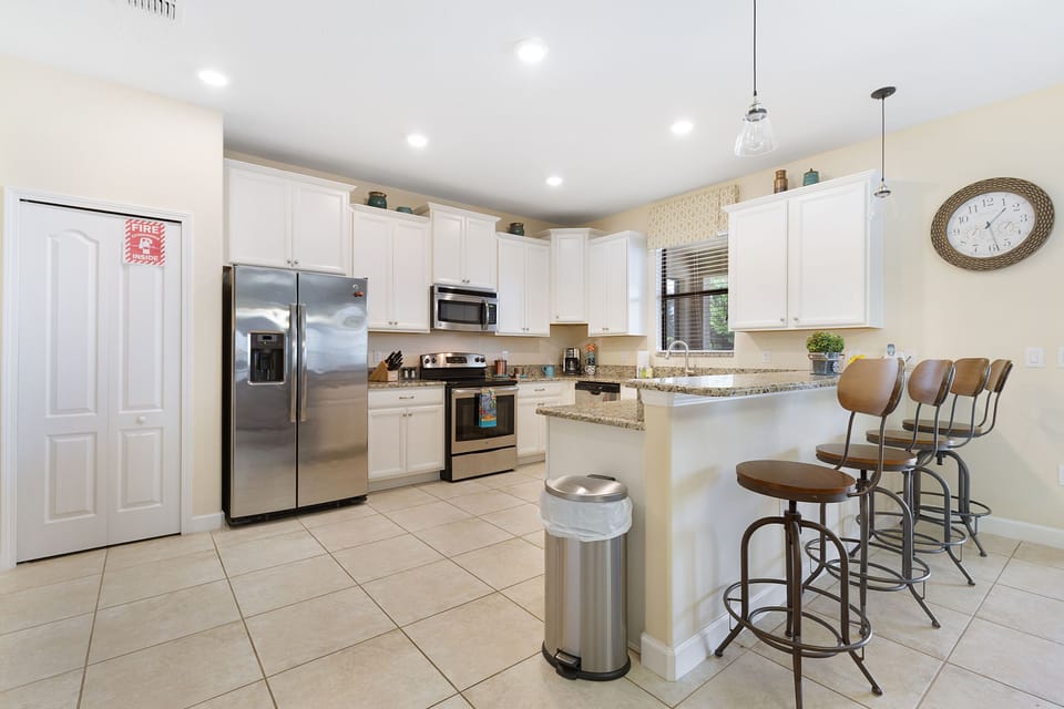 Cook gourmet meals in the the fully equipped kitchen with stainless steel appliances