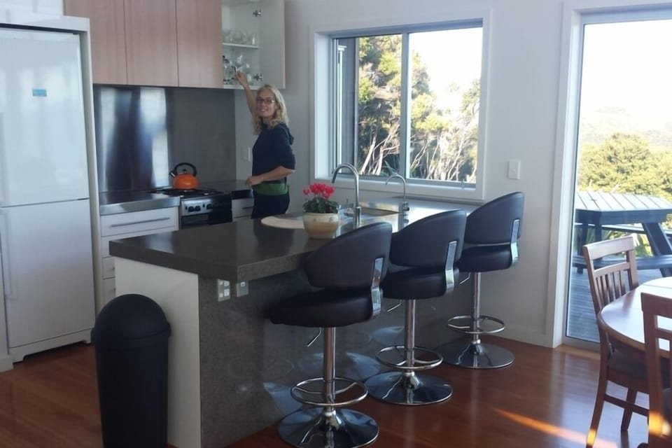 kitchen with gas stove and fridge freezer