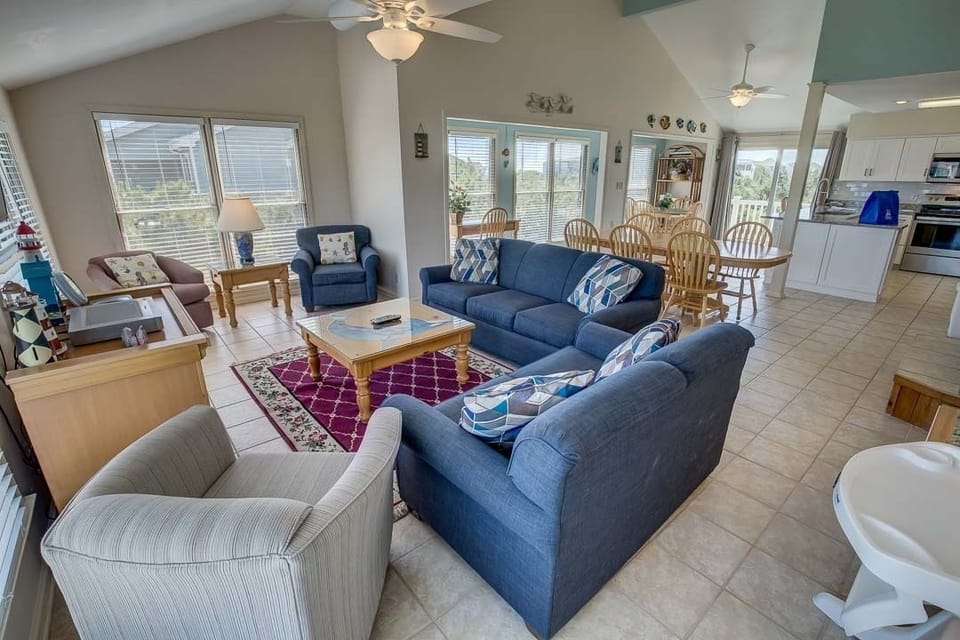 Top-Level Living Room with Deck Access ** The high chair seen in photos is no longer at the property. If baby equipment is needed local rental options can be provided. **