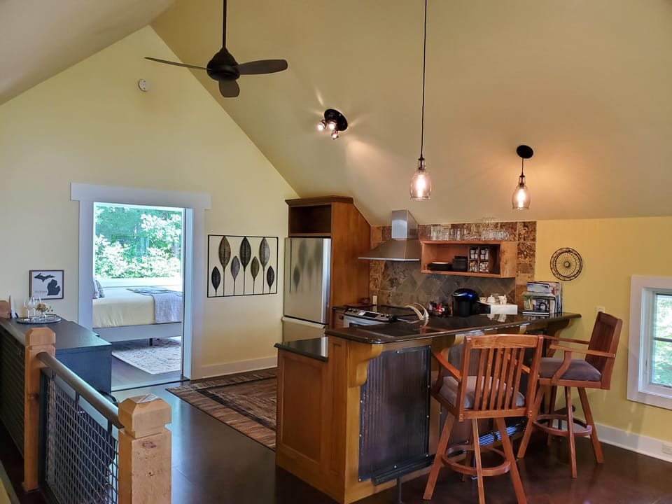 High ceilings and nature views at both 'ends' of the house. Barn door to Master.