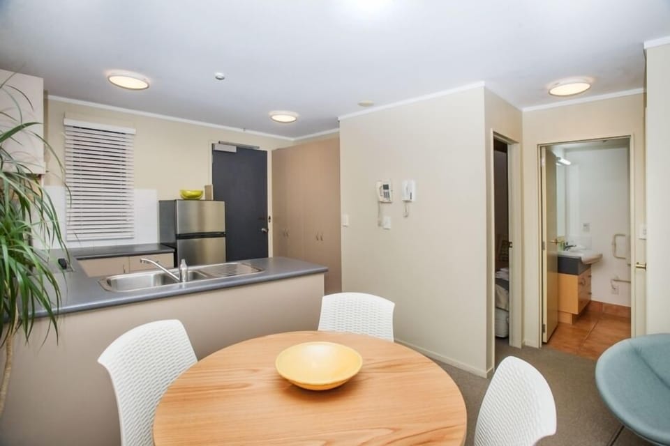 Dining, kitchen and peep of bathroom