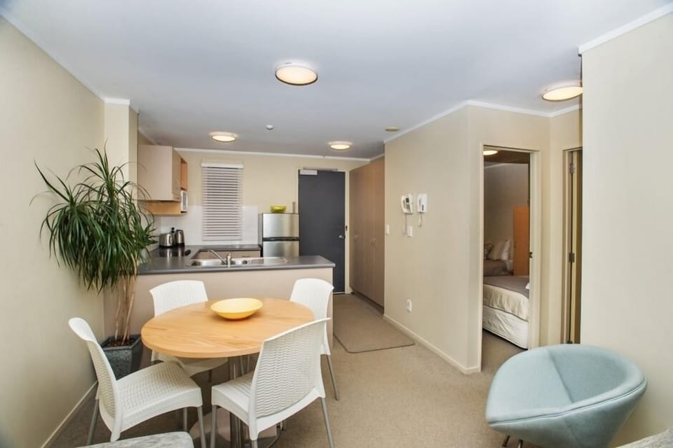 Dining, kitchen and peep of second bedroom
